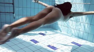 Gypsy black haired babe swimming underwater