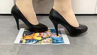 Girl trampling crushing paper in black high heels